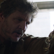 Joel stares intently at another man in a torture scene from HBO's The Last of Us.